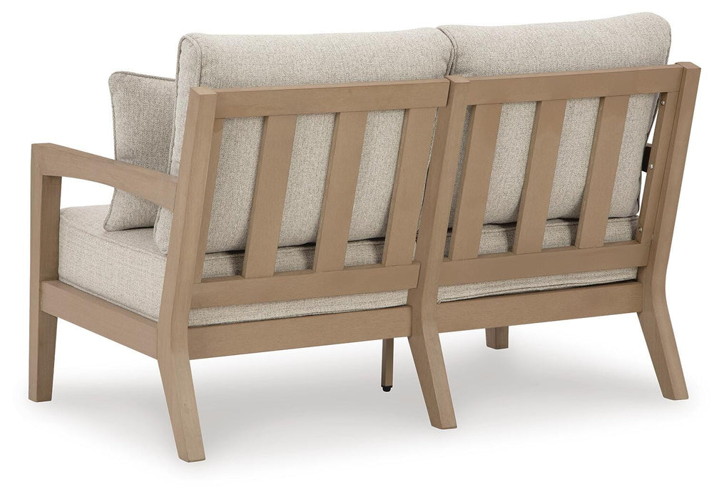 Hallow Creek Outdoor Loveseat with Cushion - De Avenue Furniture