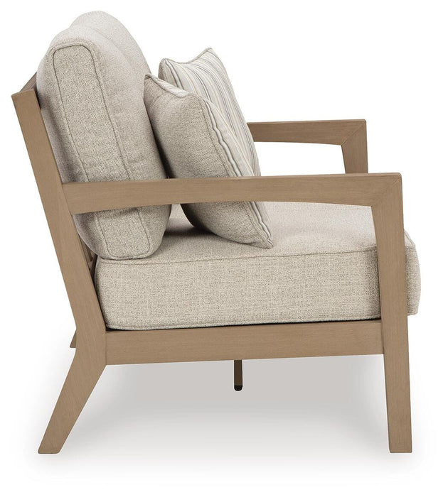 Hallow Creek Outdoor Loveseat with Cushion - De Avenue Furniture